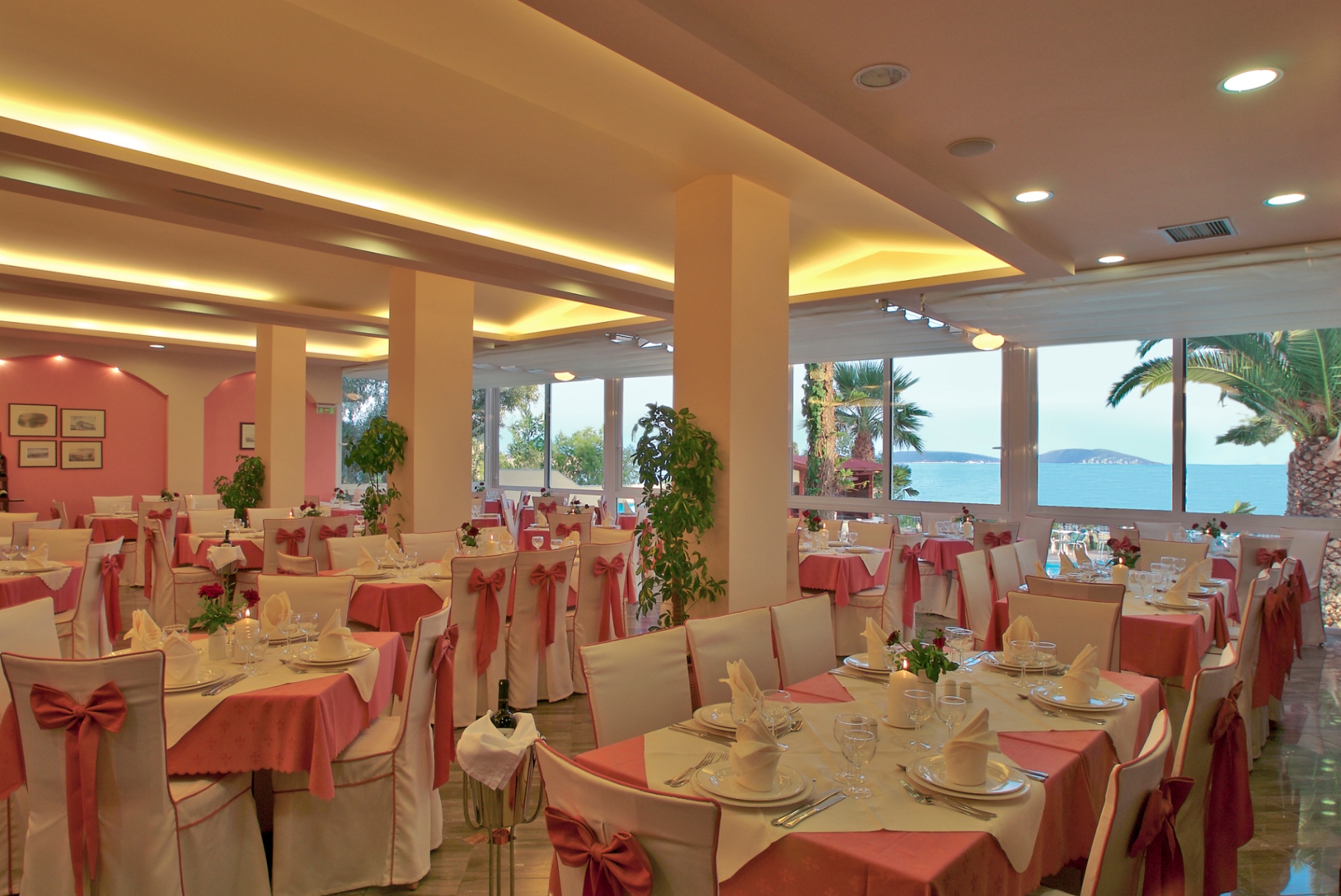 Restaurant dining room with sea view at Tolon Holidays Hotel