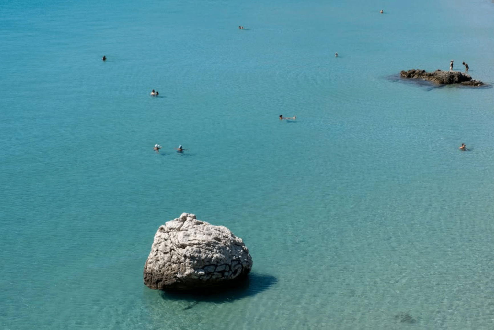 Crystal-clear swimming cove in Tolo