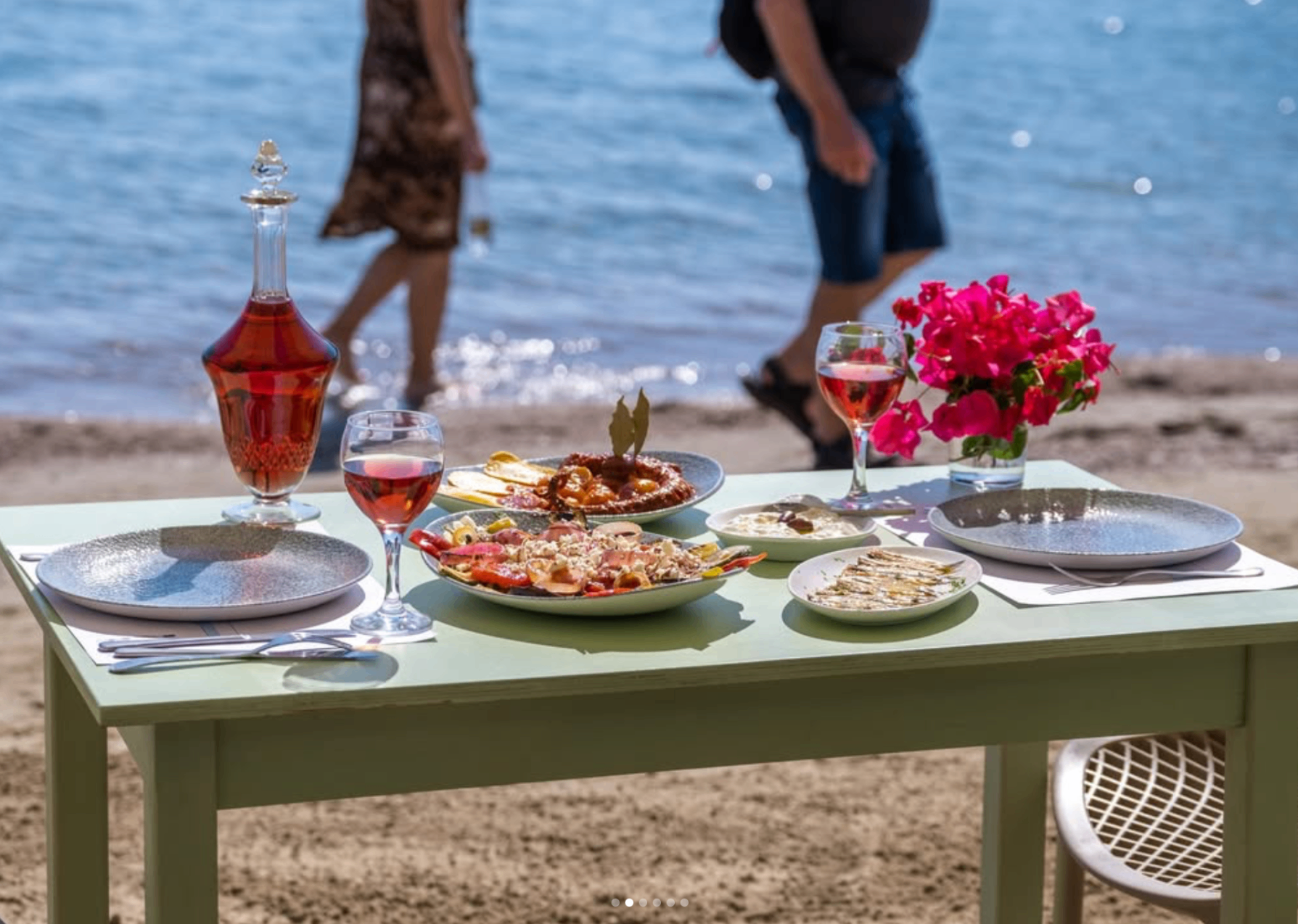 Beach dining in Tolo with local dishes