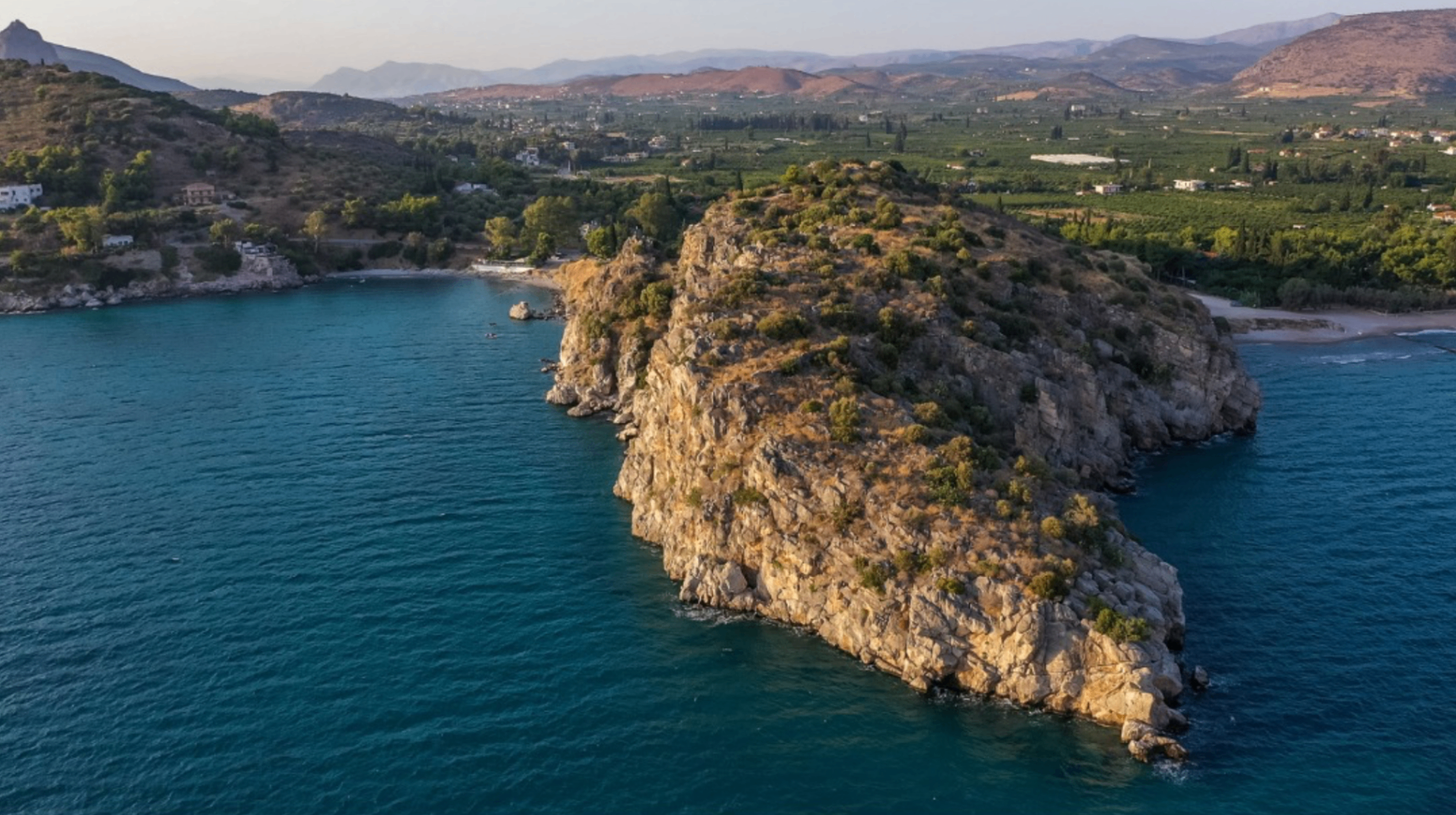 Rocky peninsula aerial view near Tolo