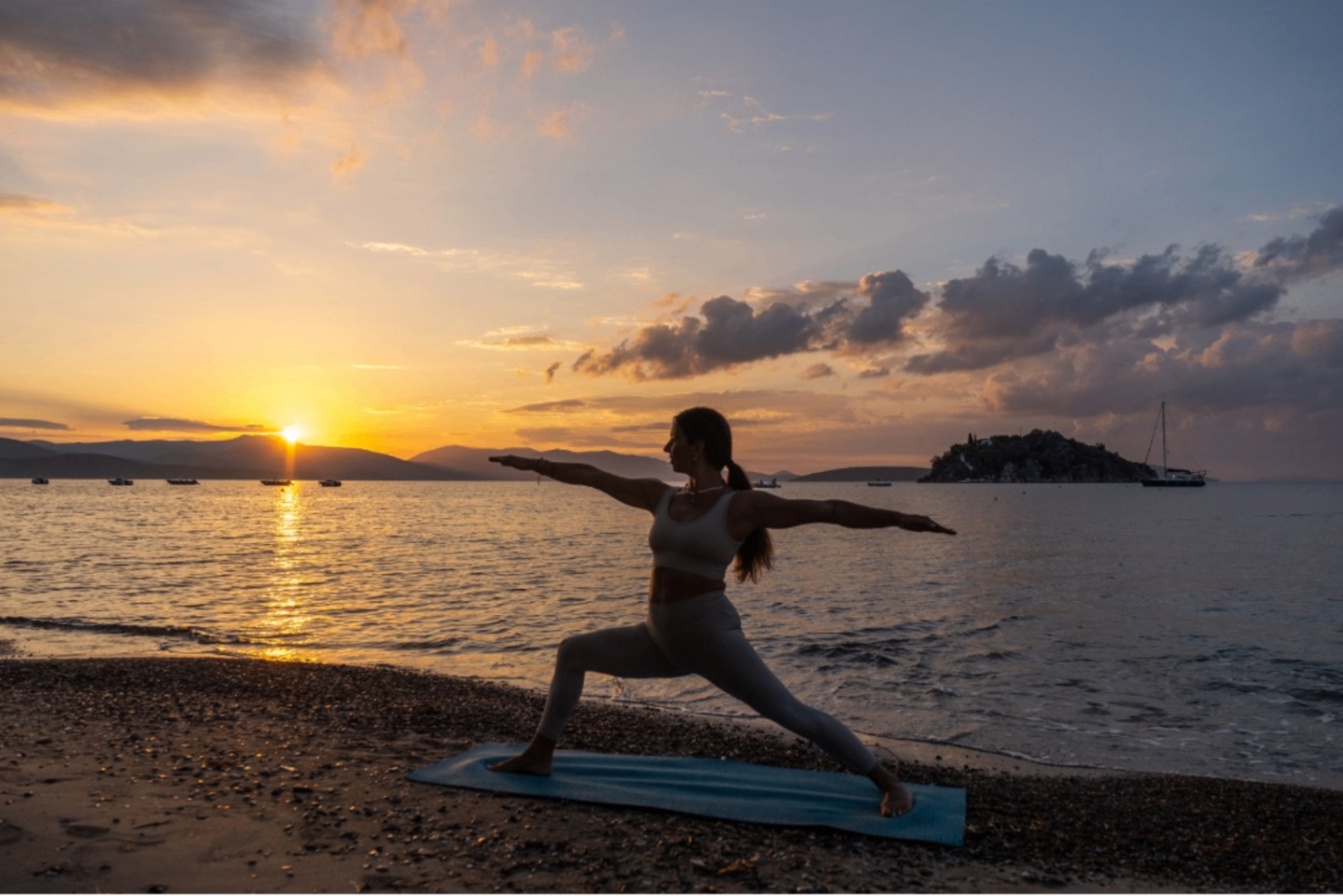 Sunset yoga on the beach in Tolo
