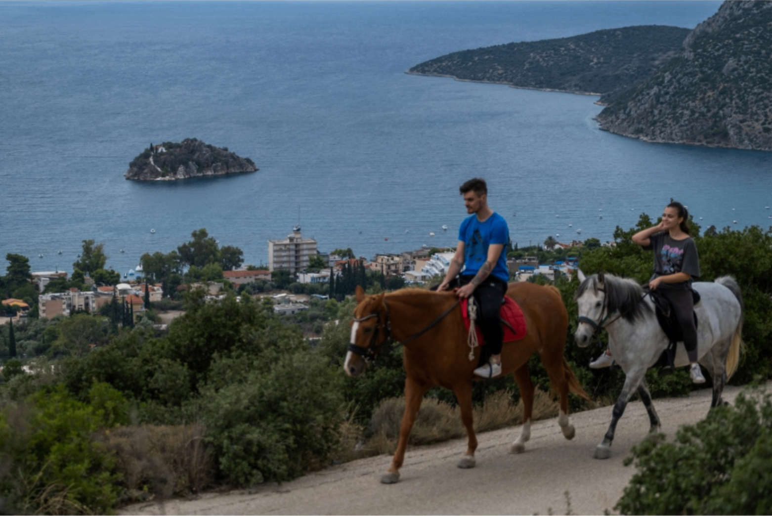 Horse riding above Tolo with panoramic bay views